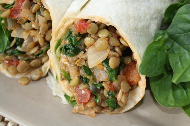 Lentil Spinach Burritos in a tortilla on a plate