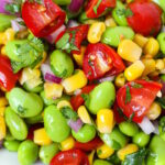 Close up view of edamame corn salad with lemon dressing