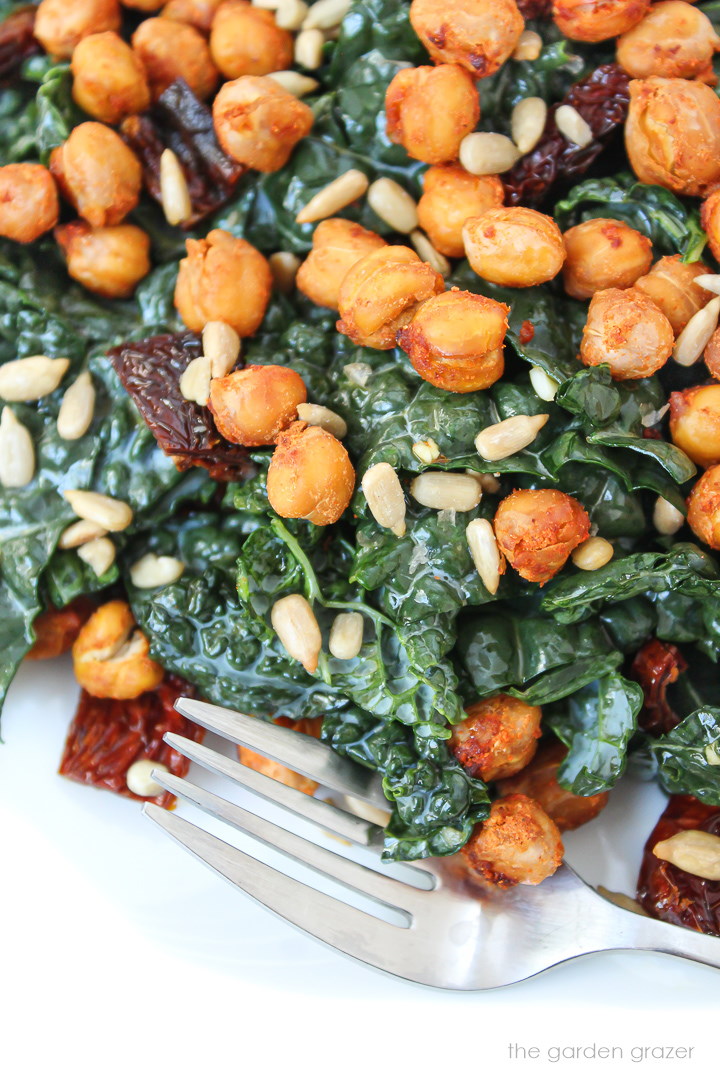 Close-up view of kale salad with chickpeas and sun-dried tomatoes