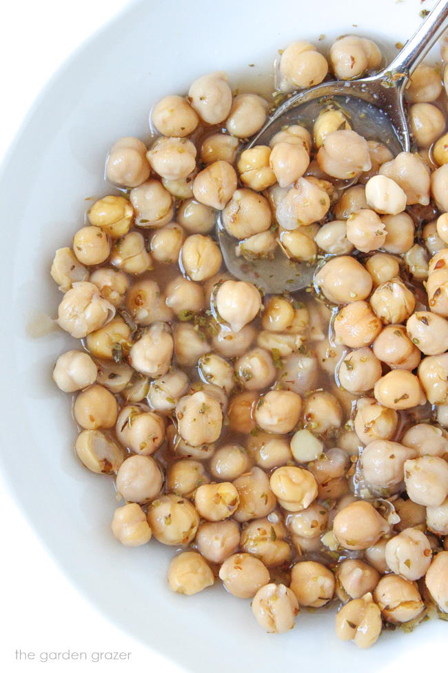 Bowl of marinated chickpeas in lemon-vinegar dressing
