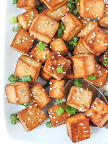 Plate of easy baked tofu cubes with sesame seeds