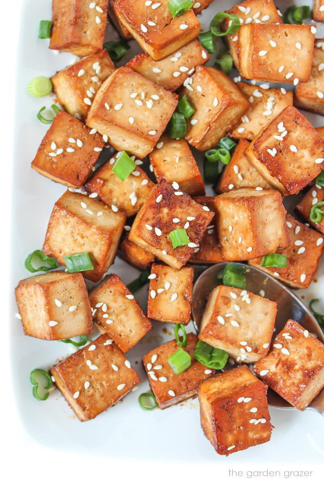 Plate of easy baked tofu cubes with sesame seeds