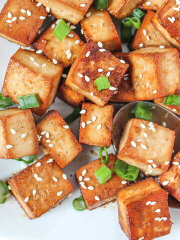 Easy vegan baked tofu on a white plate