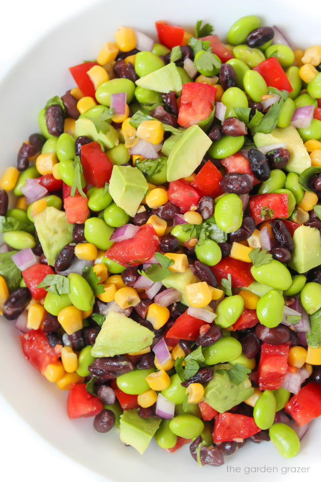 Vegan black bean avocado salad in a white bowl