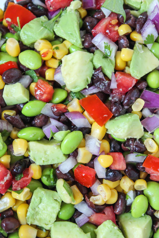 Close up view of black bean avocado salad with edamame