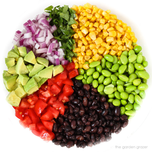 Bowl with ingredients for avocado edamame salad