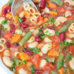 Bowl of vegan minestrone soup with kidney beans and pasta