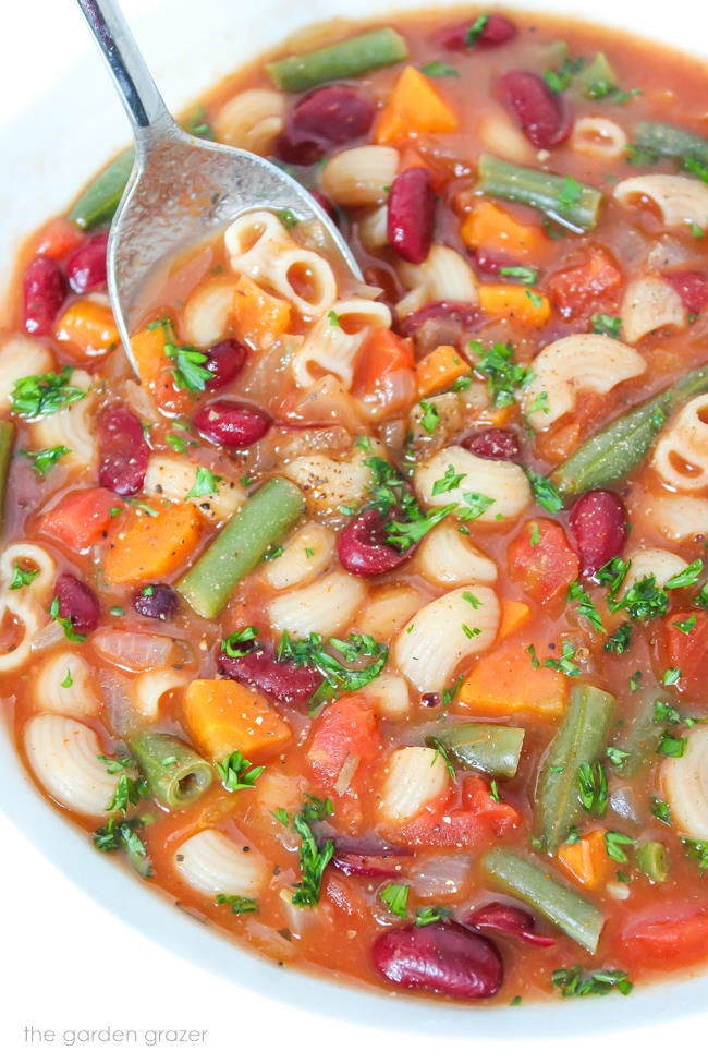 Bowl of vegan minestrone soup with kidney beans and pasta