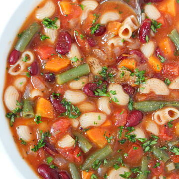 Vegan minestrone soup in a bowl with spoon
