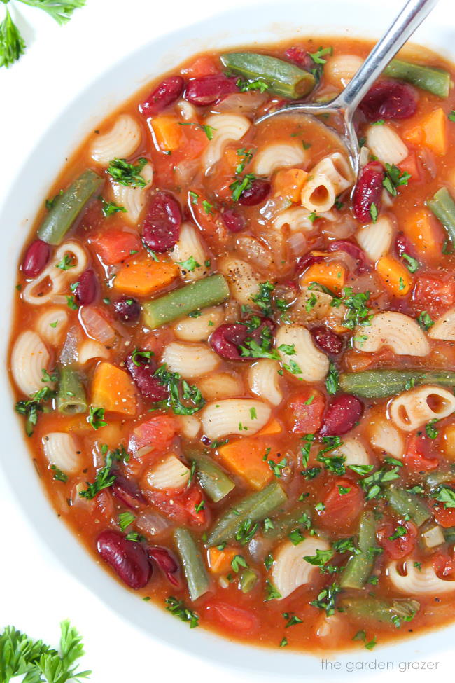 Vegan minestrone soup in a bowl with spoon