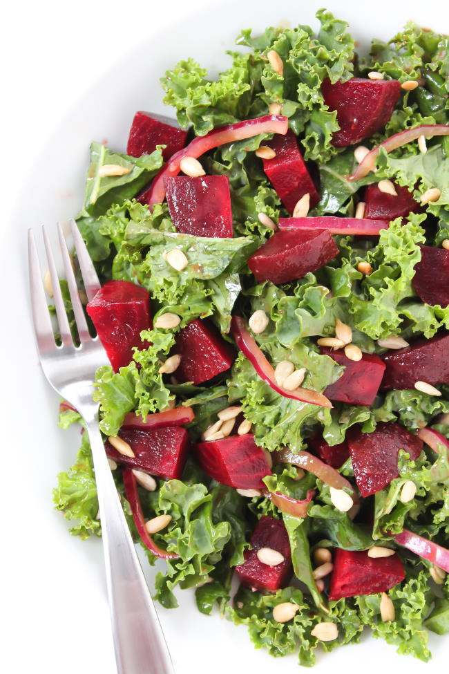 Balsamic Beet Kale salad on a plate with fork