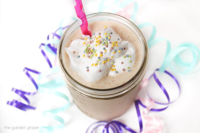 Vanilla cake batter shake in a jar with straw