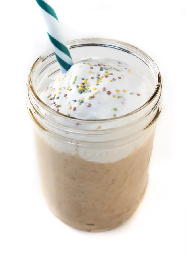 Vegan cake shake in a glass with straw