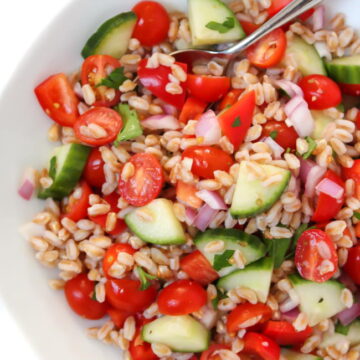 Vegan Greek Farro Salad in a bowl with spoon