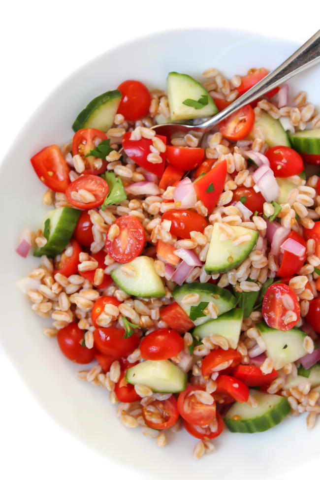 Vegan Greek Farro Salad in a bowl with spoon