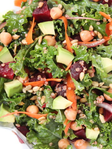 kale superfood power salad in a white bowl