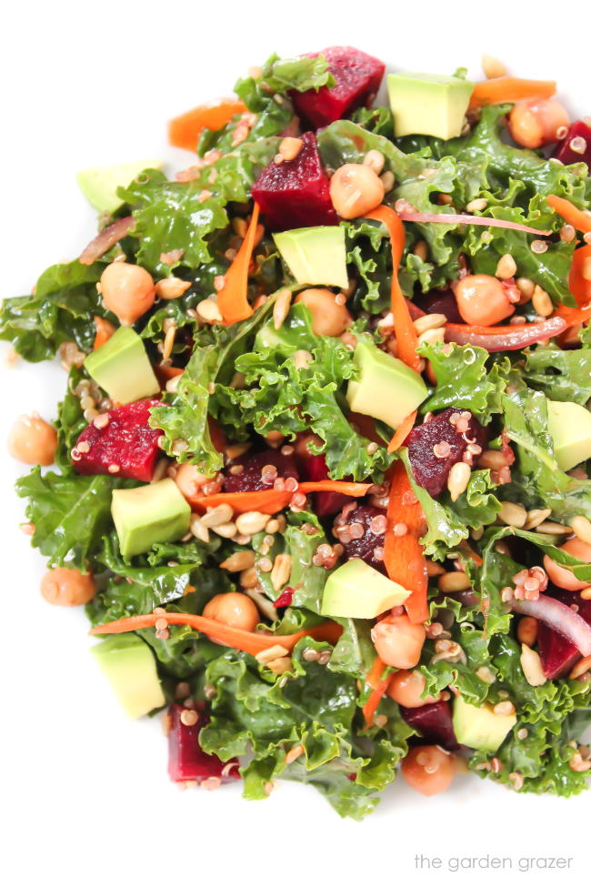 Kale superfood salad in a bowl with avocado and beets