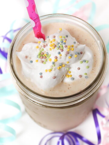 Vegan birthday cake shake in a small glass jar