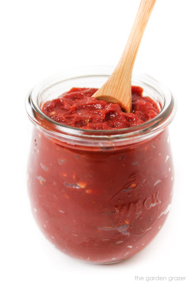Homemade pizza sauce in a small glass jar
