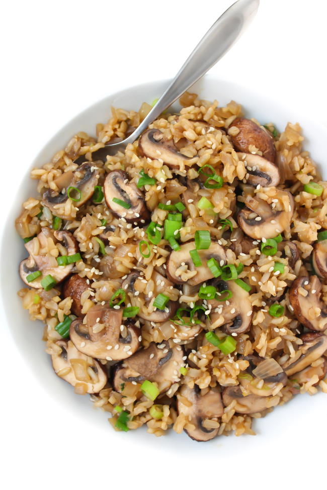 Bowl of mushroom rice with spoon