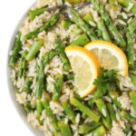 Lemon Garlic Orzo with asparagus in a bowl with spoon