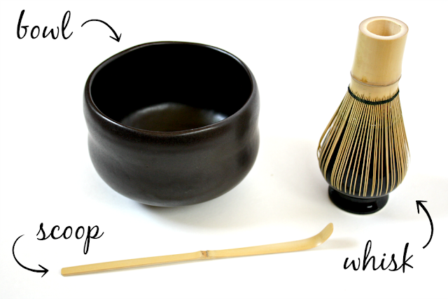 Tools needed for whisking matcha, including a bowl, scoop, and bamboo whisk