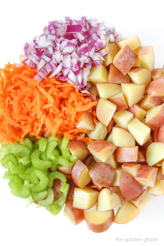 Ingredients for potato salad in a bowl before mixing