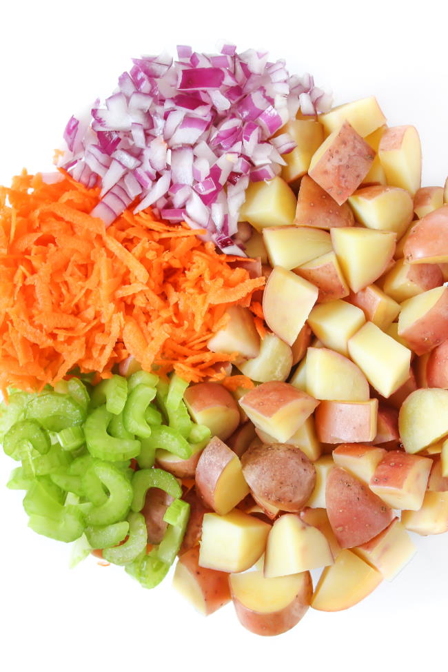 Ingredients for potato salad in a bowl before mixing