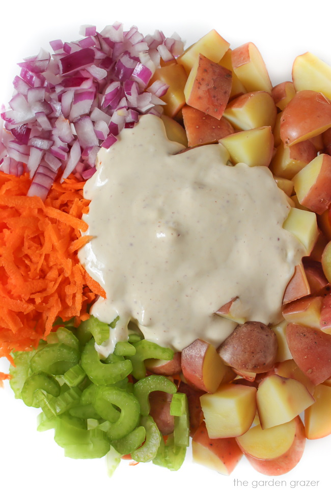 Ingredients for vegan potato salad prepared in a bowl