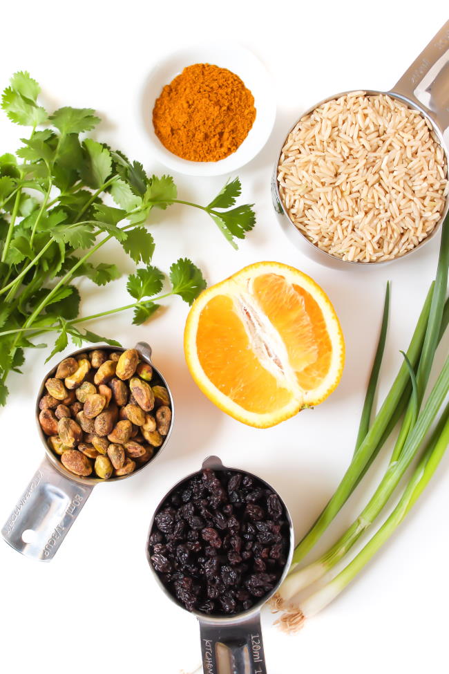 Ingredients on a table for curried rice salad with orange