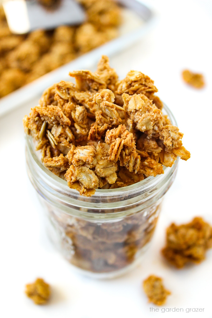 Vegan peanut butter granola in a small glass jar