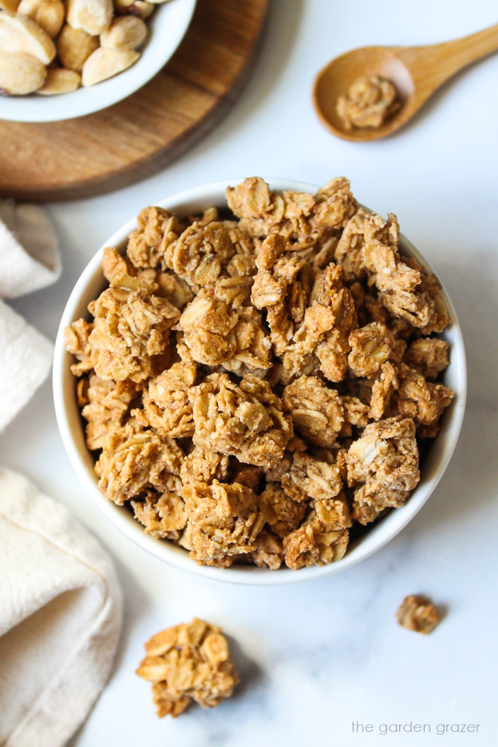 Overhead view of oil-free peanut butter granola in a white serving bowl