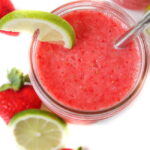 Overhead view of strawberry lime watermelon slush with straw