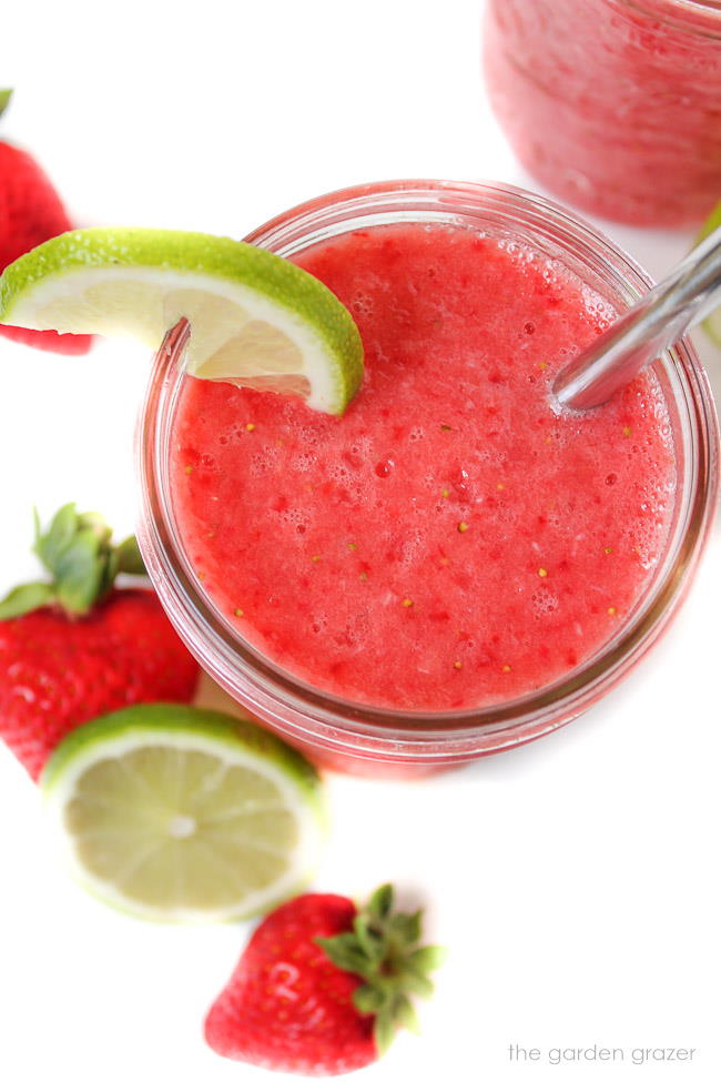 Overhead view of strawberry lime watermelon slush with straw