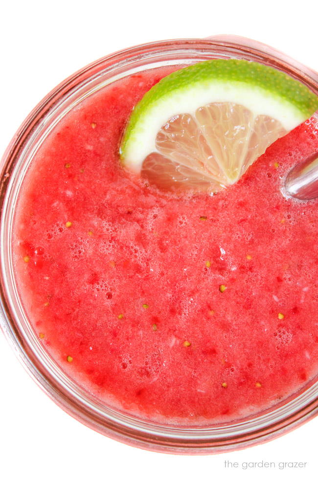 close up view of watermelon lime slush in a glass
