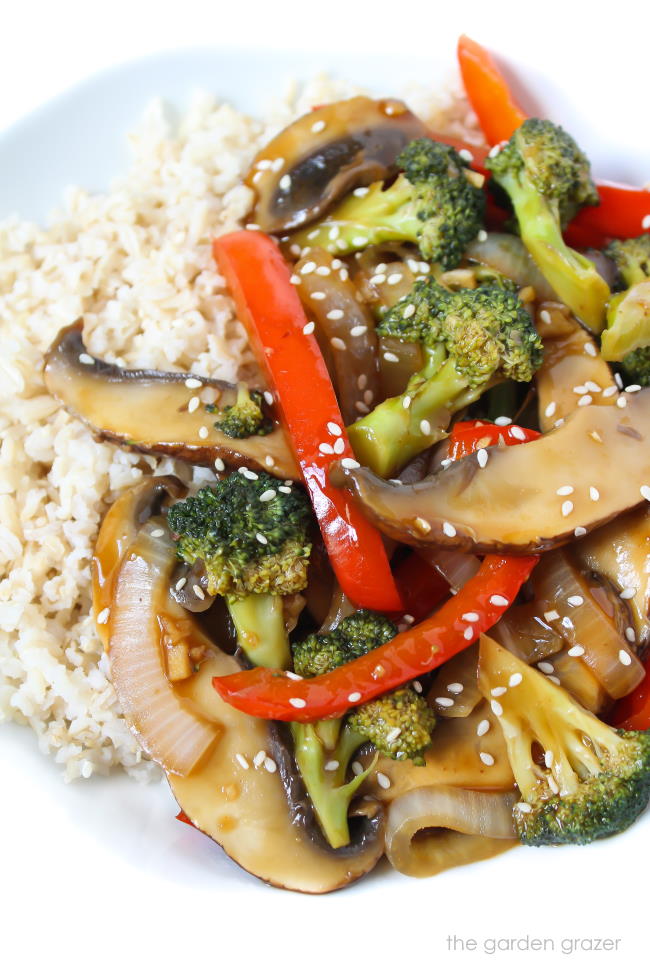 Vegan mushroom stir fry on a plate with brown rice