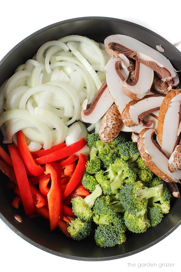 Ingredients for stir fry in a large skillet ready to saute