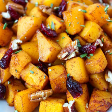 Close up view of maple cinnamon butternut squash served on a white plate