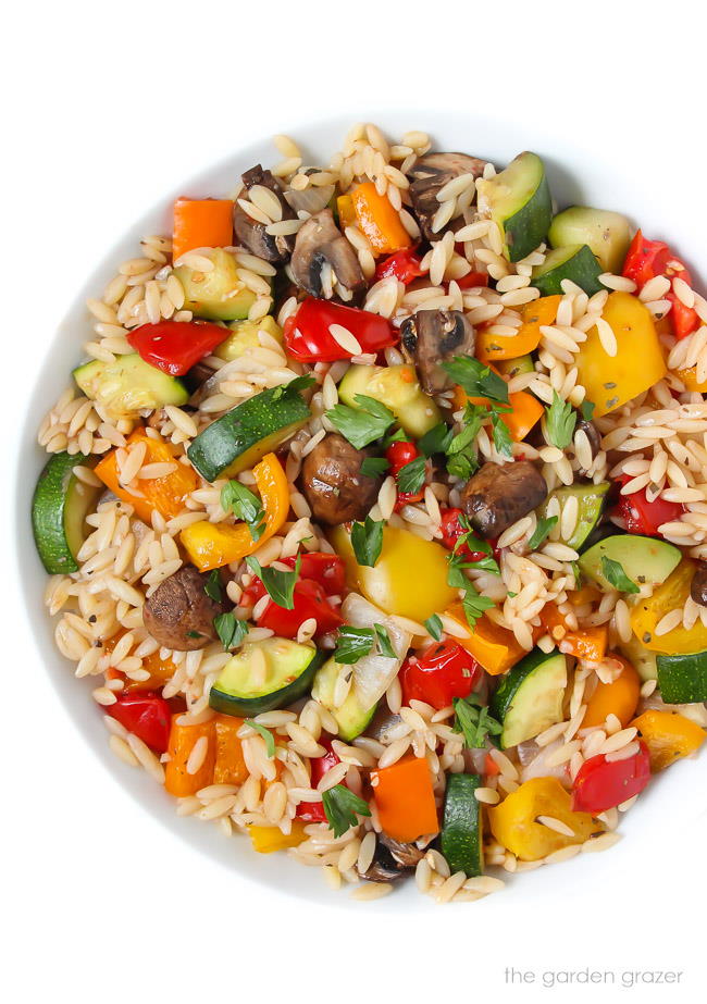 Bowl of orzo tossed with roasted vegetables