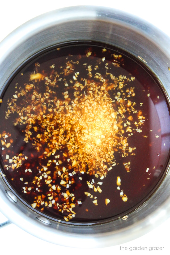 Overhead view of teriyaki sauce preparation in a small saucepan