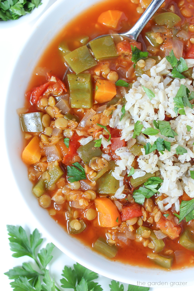 Bowl of stuffed pepper soup with brown rice and spoon