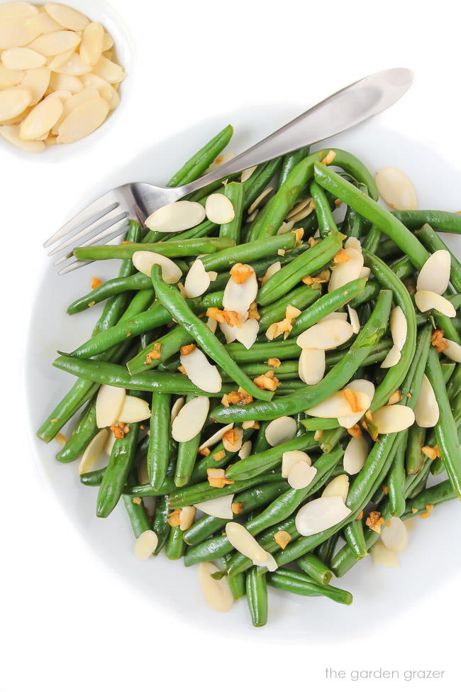 Almond green beans on a plate with fork