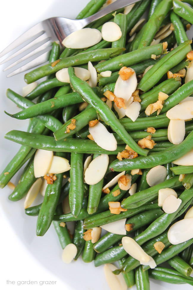 Almond Garlic Green Beans on a plate with fork