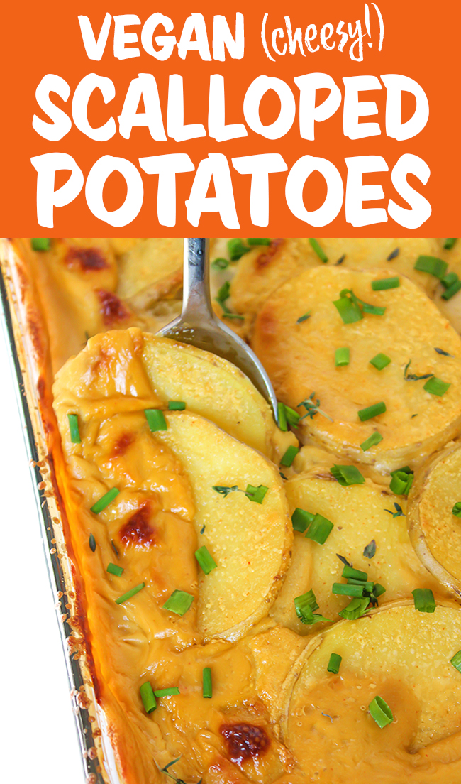 Spoon scooping out scalloped potatoes from a pan