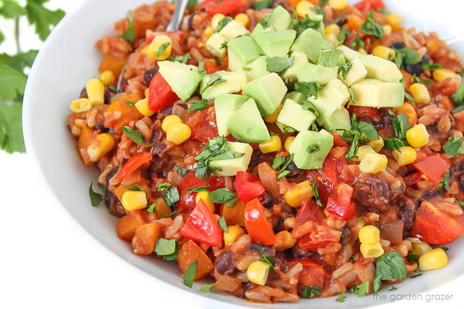 Bowl of cheesy fiesta black beans and brown rice