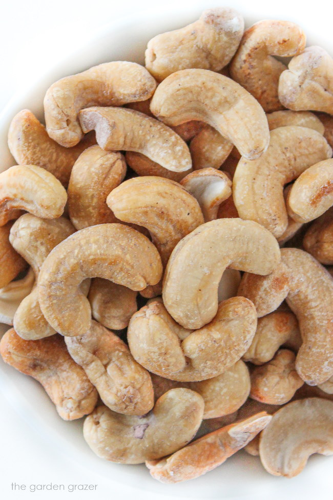 Roasted cashews in a white bowl