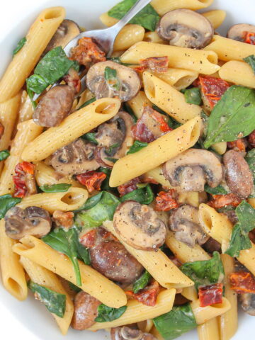 Vegan creamy mushroom pasta in a white bowl