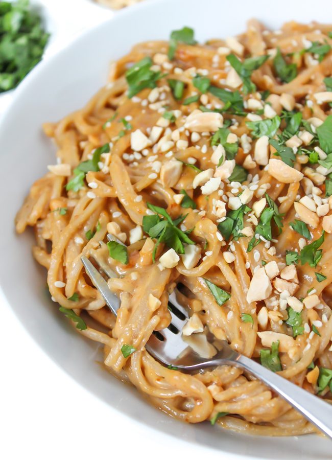Easy Asian-inspired Peanut Noodles in a bowl with fork