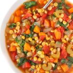 Bowl of Vegan Split Pea Soup with a spoon