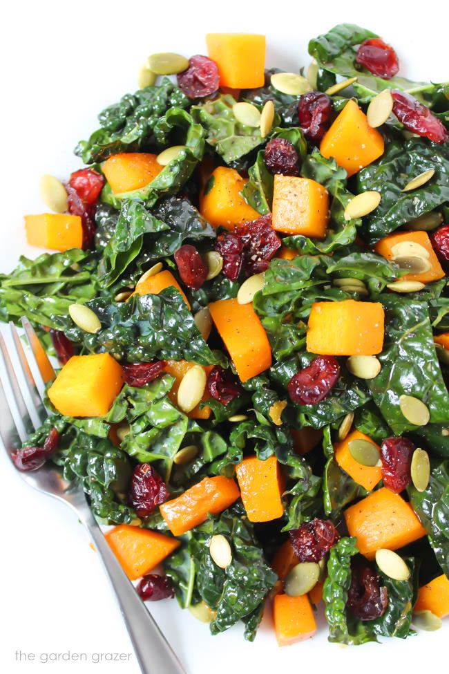Butternut squash kale salad on a plate with fork